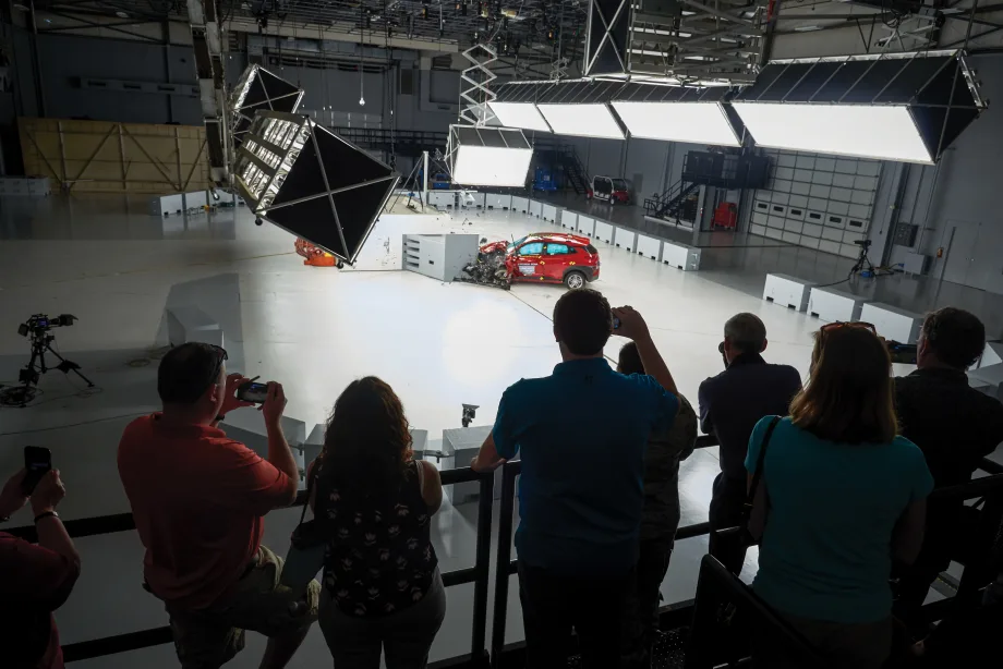 Attendees watch a live vehicle crash test at the IIHS Vehicle Research Center, where fleet professionals can observe safety testing and advanced crash-avoidance technologies in action.
