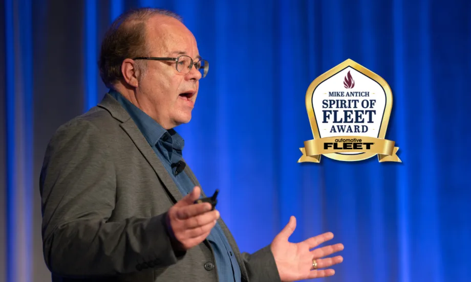 Mike Antich speaking, with Spirit of Fleet Award logo