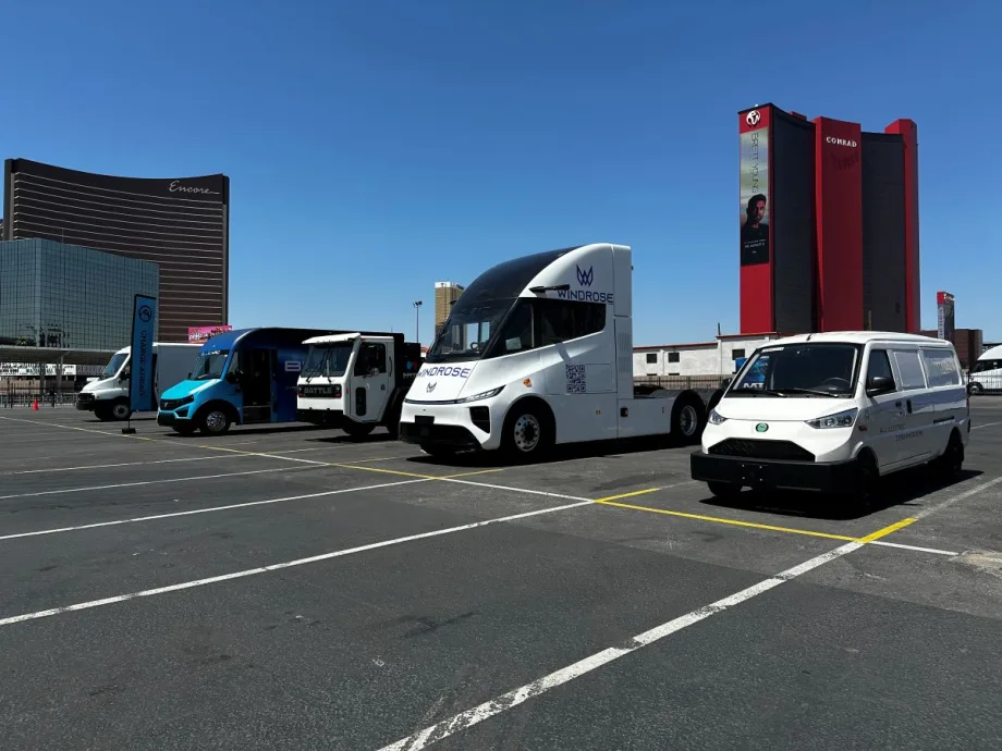 Alt-fuel and alt-power commercial vehicles in a parking lot at an exposition.