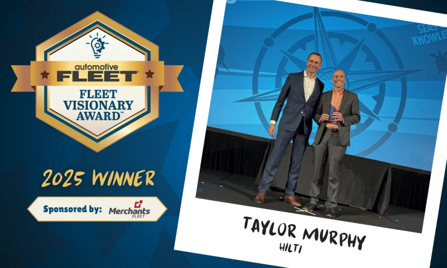 fleet manager accepting award on stage.