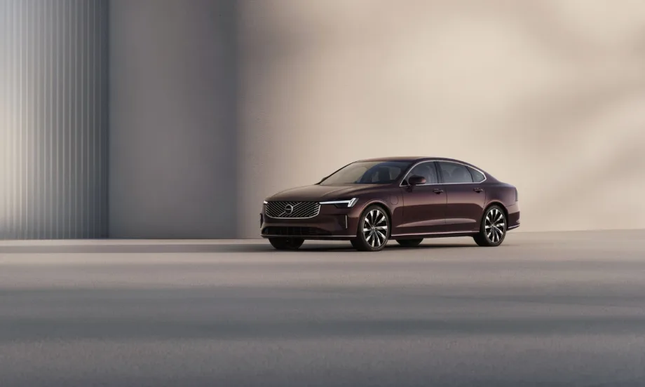 A maroon Volvo S90.