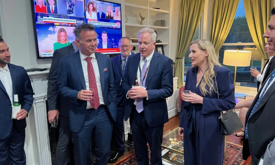 ACRA executives with a Congresswoman in the living room of an event house during a PAC fundraiser.