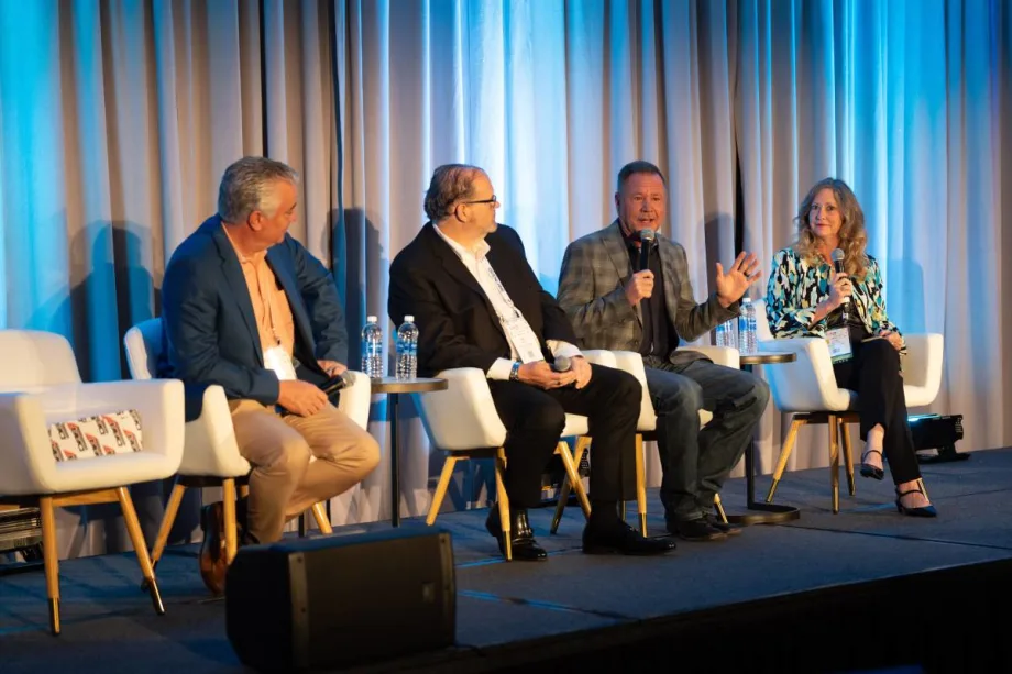Panelists on stage at CAR conference.