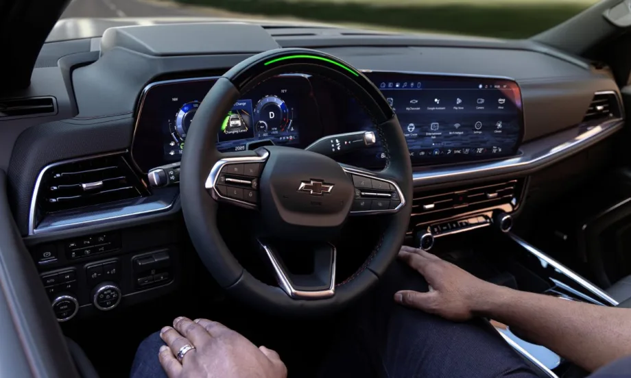 A driver sitting in the passenger seat of a 2025 Chevrolet Tahoe RST while Super Cruise pilots the vehicle.