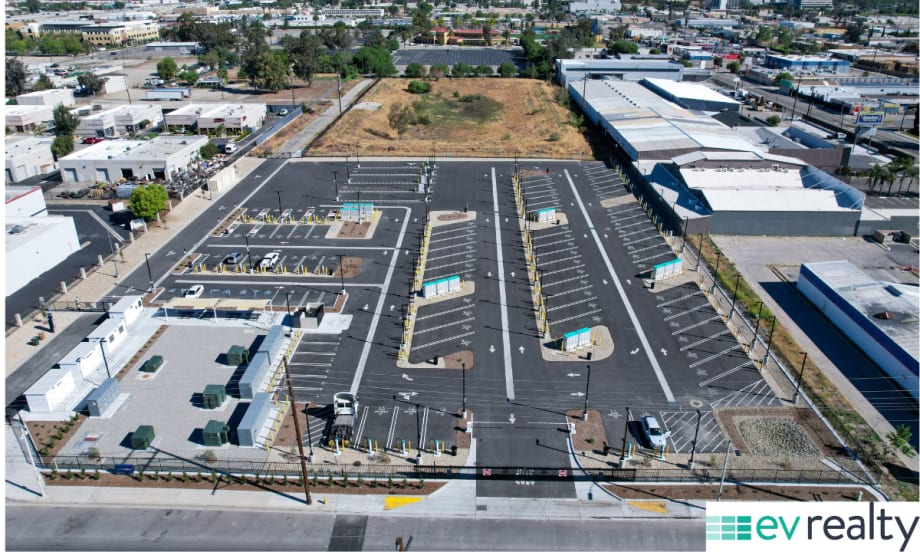Aerial view of large EV truck charging hub in San Bernardino with multiple charging lanes and infrastructure for fleet vehicles.