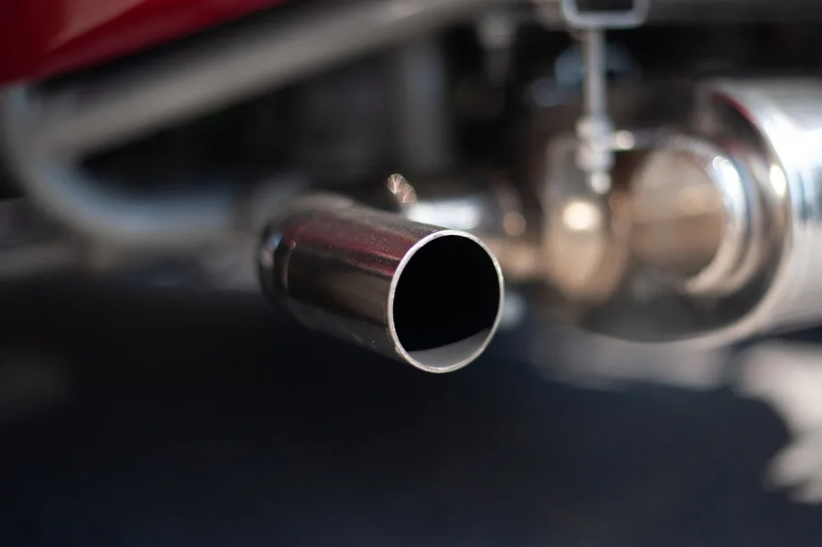 Photo of exhaust pipes of older car.