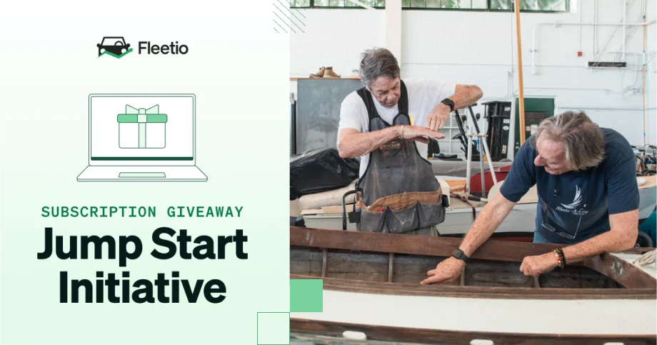 Two men working together on a wooden boat inside a workshop, alongside text for Fleetio’s Jump Start Initiative subscription giveaway