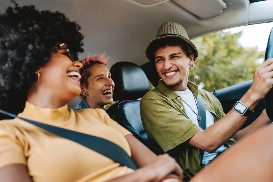 Three Gen Zers are enjoying a rental car.