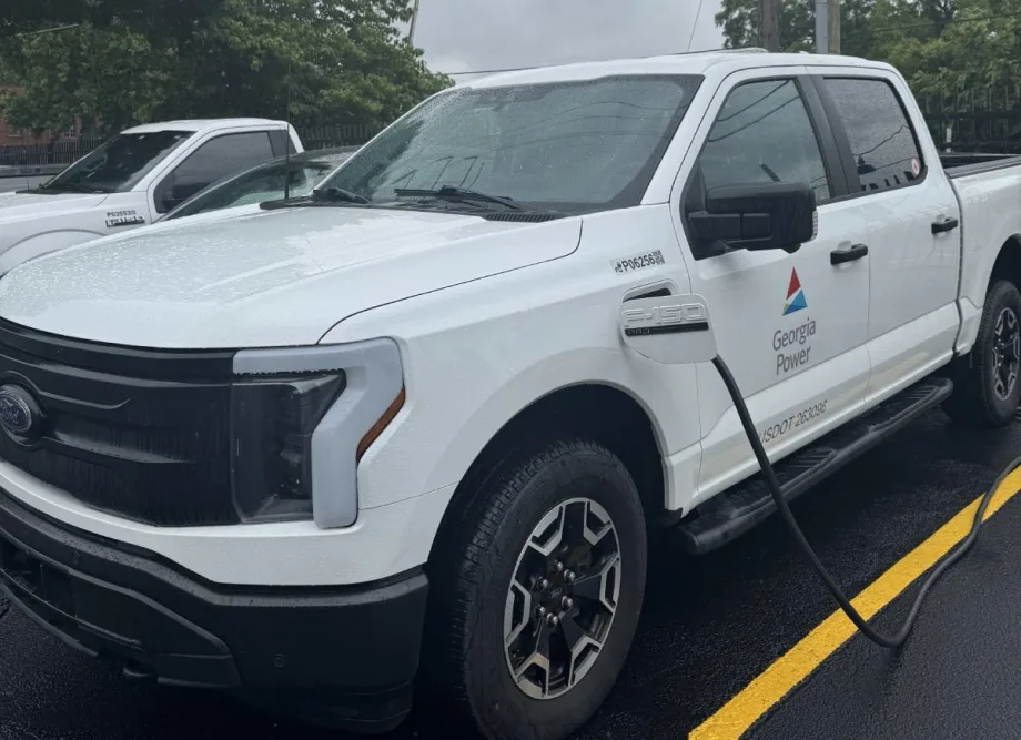 A while Georgia Power Ford F-150 Lightning electric fleet pickup truck being charged.