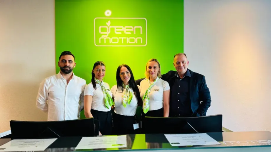 The Green Motion team at rental car counter in Zurich, Switzerland.