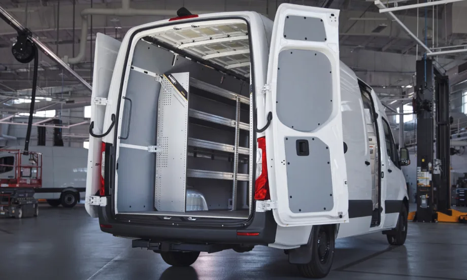 A Mercedes-Benz van with the back doors open.