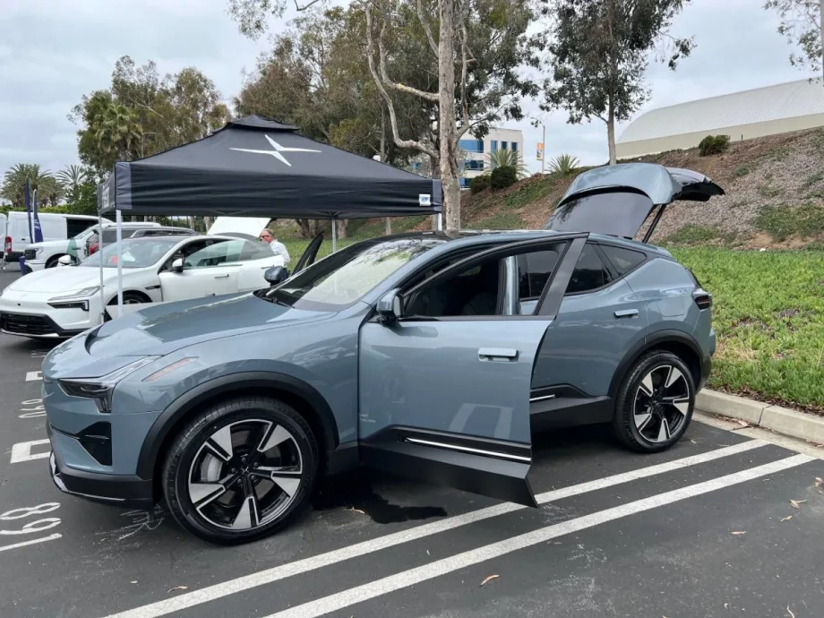 A photo of a gray Polestar hatchback sedan in a parking lot.