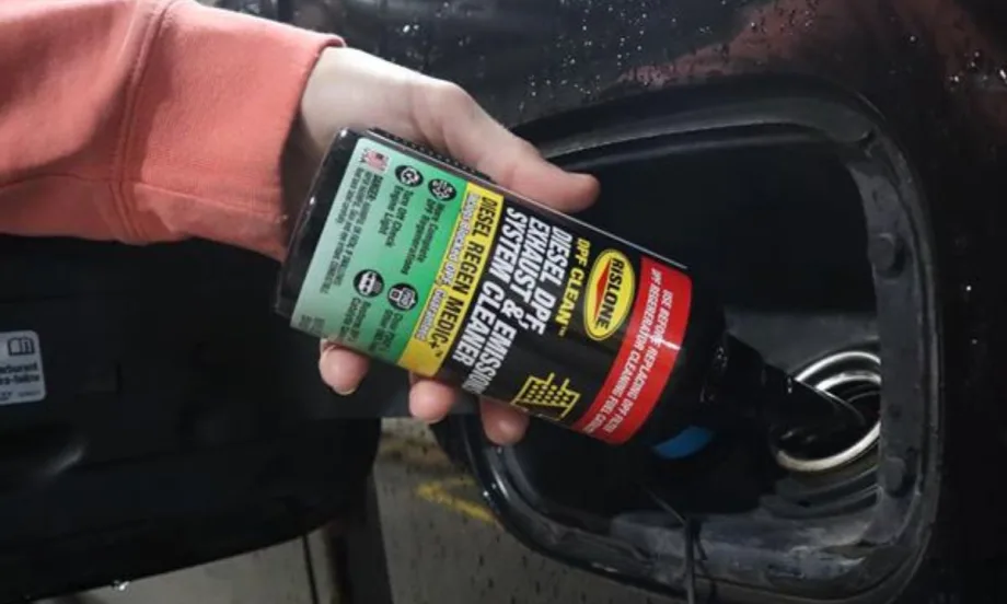 Rislone DPF Cleaner being poured into a fuel tank.