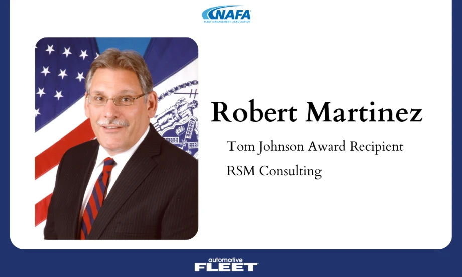 Portrait of Robert Martinez, Tom Johnson Award recipient and principal at RSM Consulting, wearing a suit and tie with a U.S. flag backdrop.