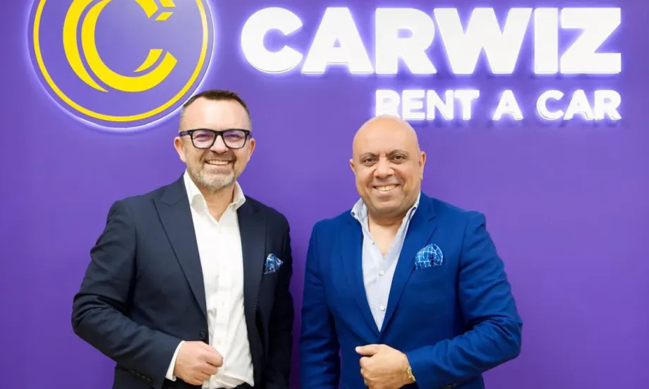 Carwiz and Sigma executives in front of Carwiz Rent A Car.