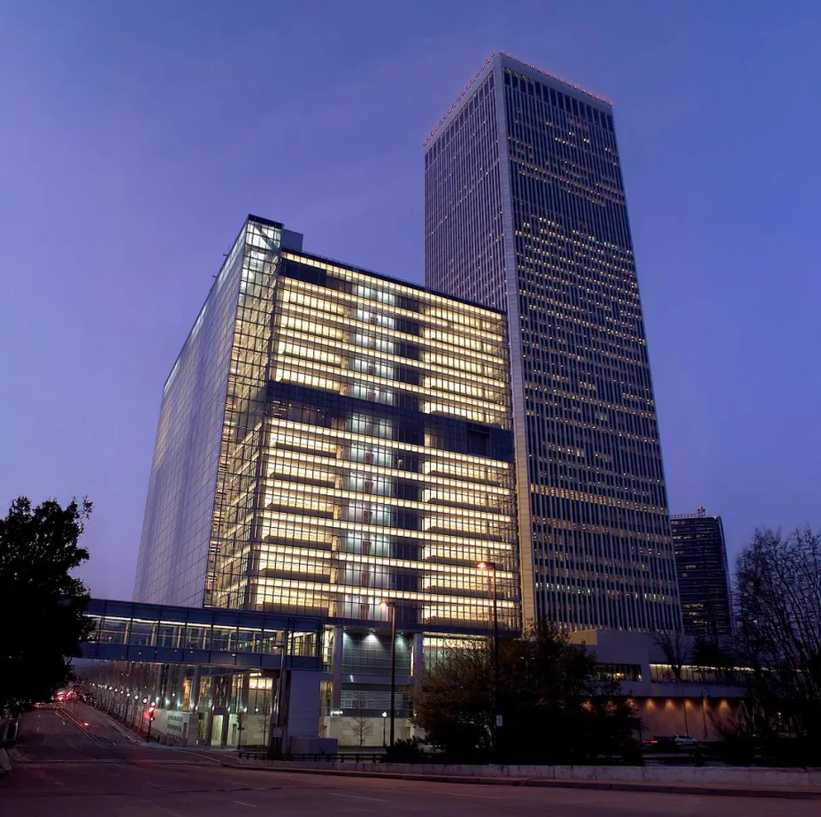 Photo of a big beautiful tall building in downtown Tulsa at sunset.
