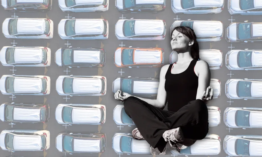 Yoga pose with vehicles in background