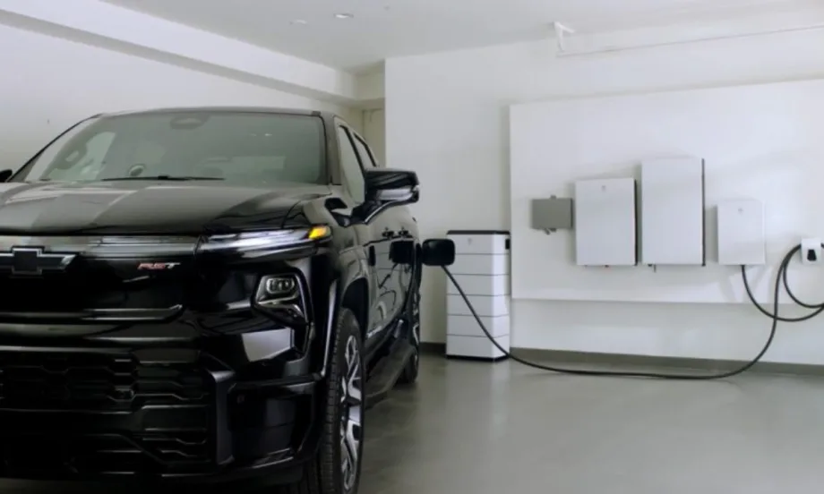 An electric truck from GM plugs into the garage side.